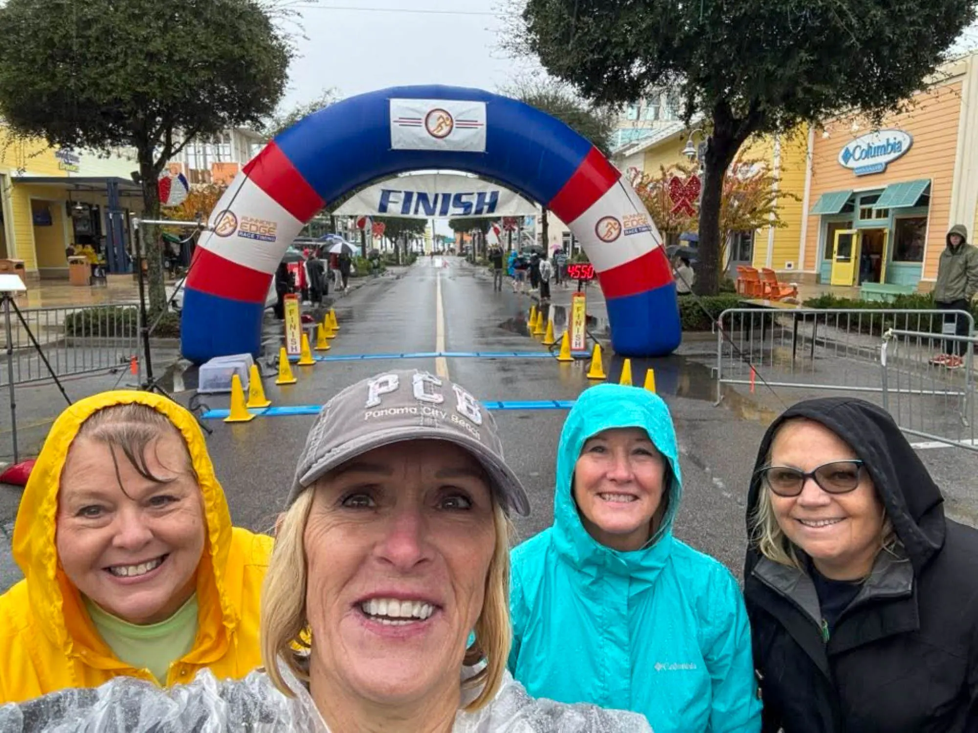 Supporting runners as they cross the finish line at the 2025 Panama City Beach Marathon.