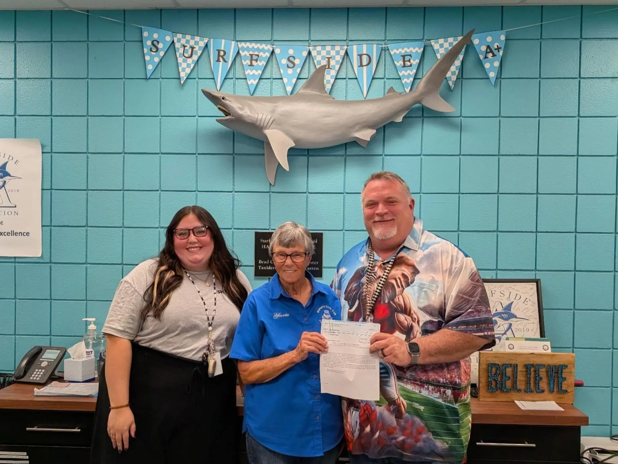 Women’s Civic Club of Panama City Beach supporting Surfside Middle School through its Community Outreach Program with a holiday donation to assist local students and families.